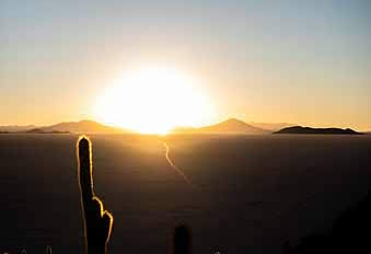 Bolivia Sun setting behind the salt flats
